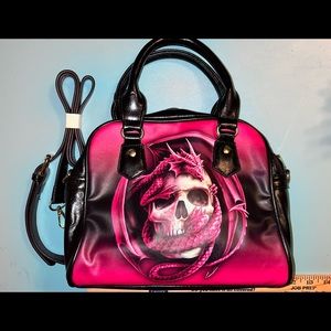Pink and black dragon and skull graphic handbag